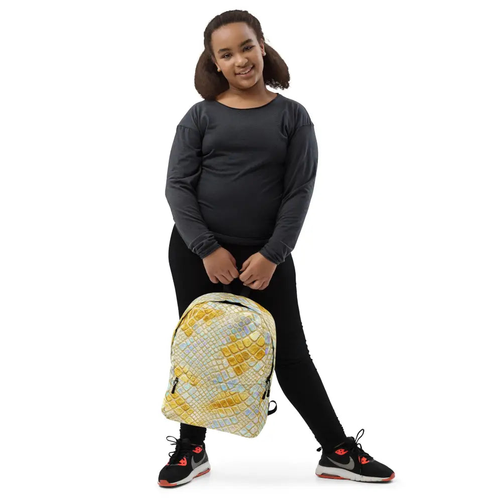 Holo Luxe Snake Backpack holographic snake print backpack with padded straps and multiple compartments worn by young girl