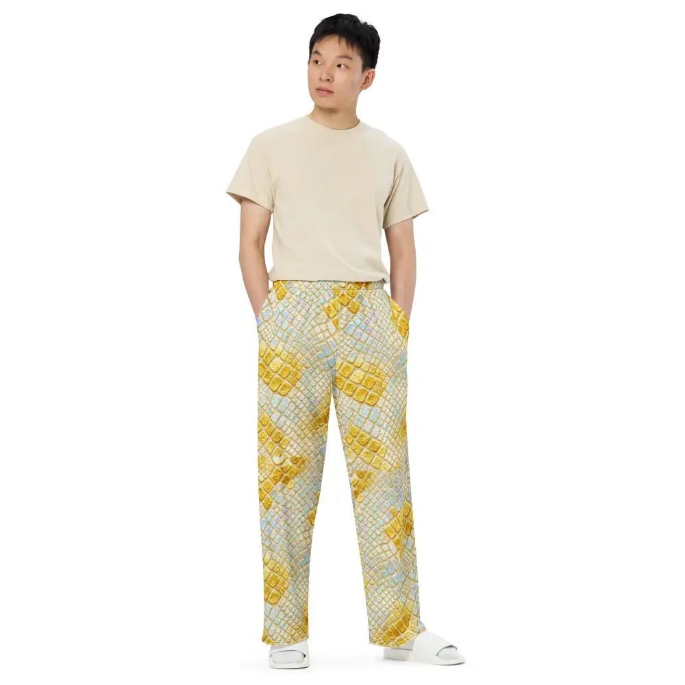 Unisex model wearing Wide Leg Glam Snake Cargo pants with gold pastel snake print and beige t-shirt